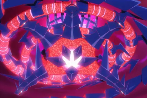 Wielogłowy, niebiesko-czerwony potwór, przypominający najpotężniejszego pokemona, otacza rozżarzone jądro.