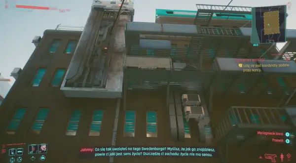 Czerwony wieszcz cyberpunk, Johnny rozmawia o sensie życia na tle industrialnej architektury.