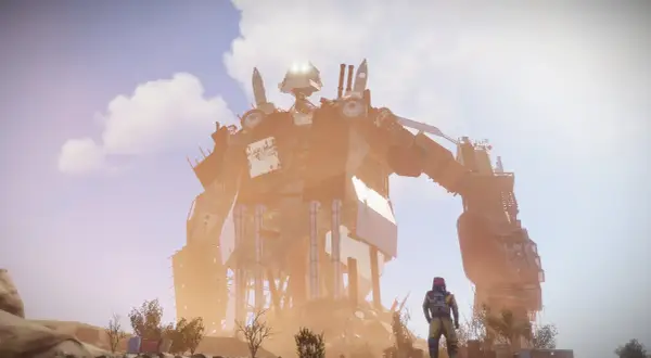 Ogromny, zardzewiały robot góruje nad pustynnym krajobrazem. Postać w żółtym kombinezonie obserwuje go, stojąc na tle tego **rust map**.